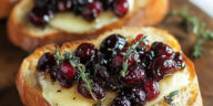 Crispy Crostini with Balsamic Roasted Cranberries and Creamy Brie