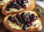 Crispy Crostini with Balsamic Roasted Cranberries and Creamy Brie